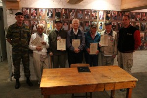 Bastogne Ceremony in Gen. McAuliffe’s  Bunker:  L to R: Col. Olivier D’Hoop, Ike Refice, Ken Yockey,  Charles Pefinis, Harry Whisler, John McAuliffe, Commander Eric Lemoine