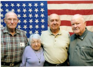 (left to right) Herbert H. Adams, 82nd AB, 504th PIR, Co D  Helen Najarian-Rusz, Nurse, 59th Evacuation Hospital. Francis J. Gaudere, 30th ID, 119th IR, Headquarters Co John E. McAuliffe, 87th ID, 347th IR  