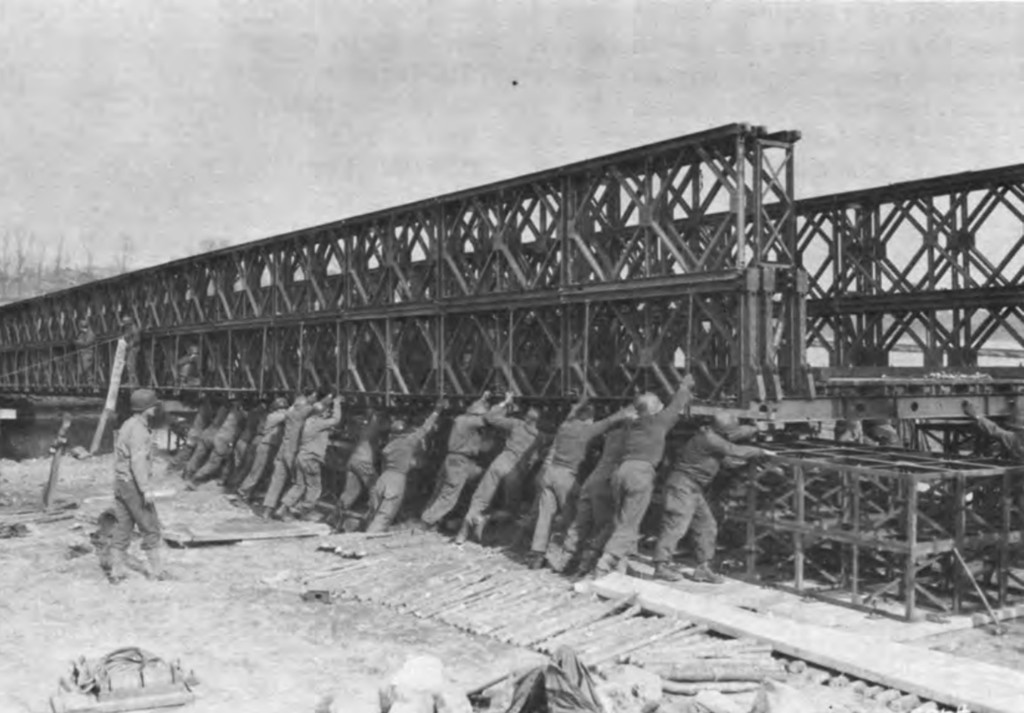 American troops building a floating Bailey Bridge, similar to the one the 148th Engineer Combat Battalion built.